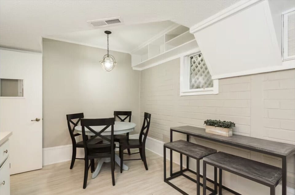 Kitchenette in basement with table and seating area
