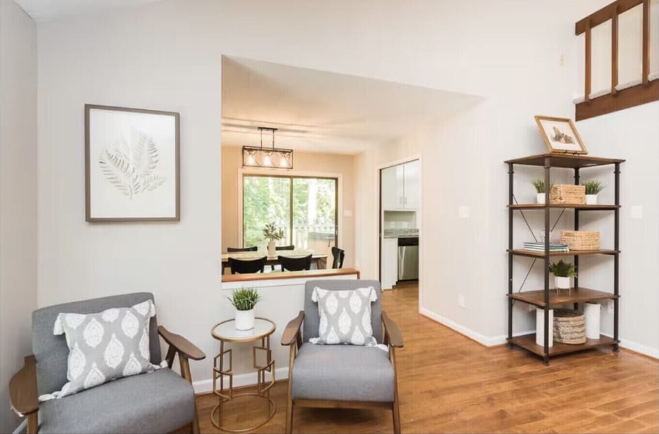 Open concept living space with extra seating and storage and stairs