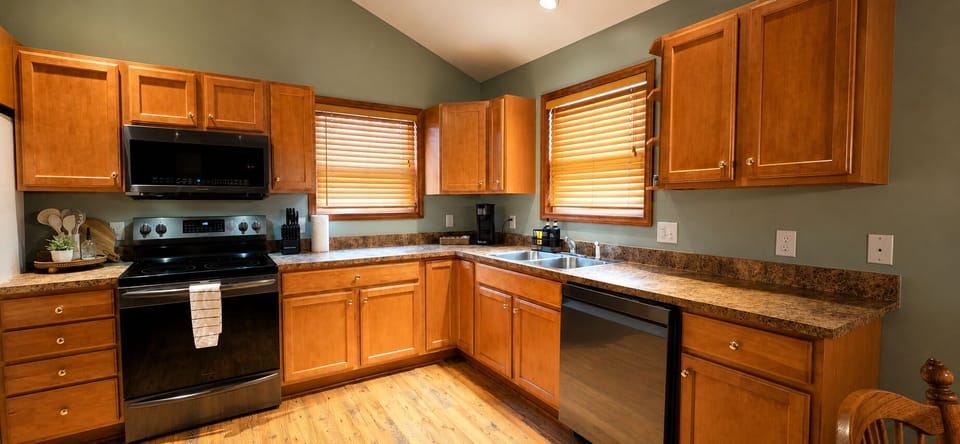 Equipped kitched w microwave,  electric stove/ oven, refrigerator & dishwasher.