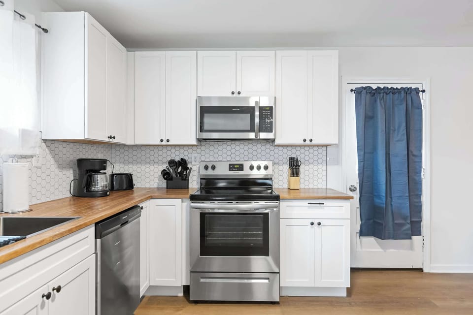 Kitchen with stove, microwave, and dishwasher 