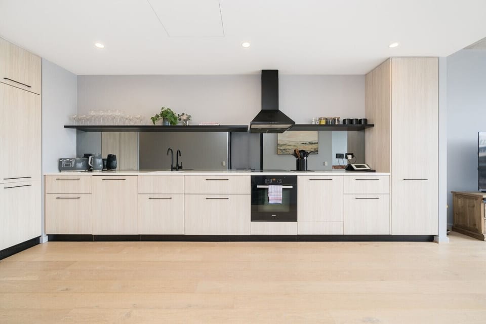 Cook up a feast in the spacious open-plan kitchen with modern appliances and plenty of bench space.