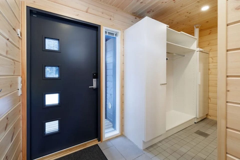 The entryway is designed for convenience with a smart lock system, allowing for a seamless and flexible self-check-in experience.