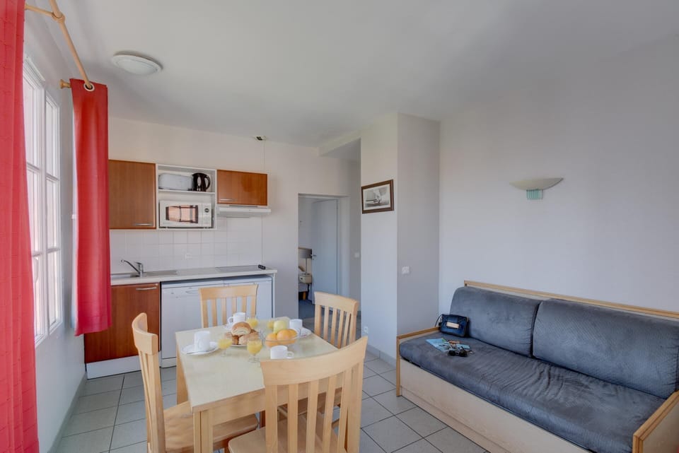 Apartment | Private kitchen | Highchair, cleaning supplies