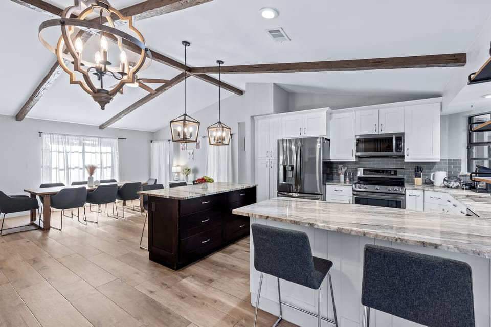 Cook, gather, and entertain with ease in this spacious chef’s kitchen featuring dual islands and poolside views.