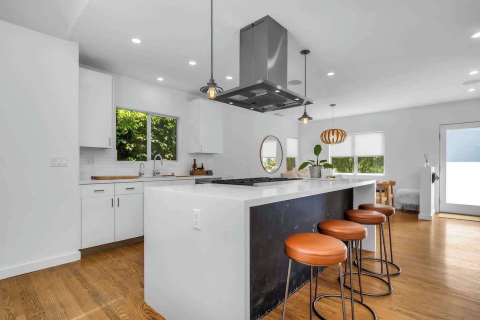 Thoughtfully designed for both cooking and connection, with island seating at the heart of the home.