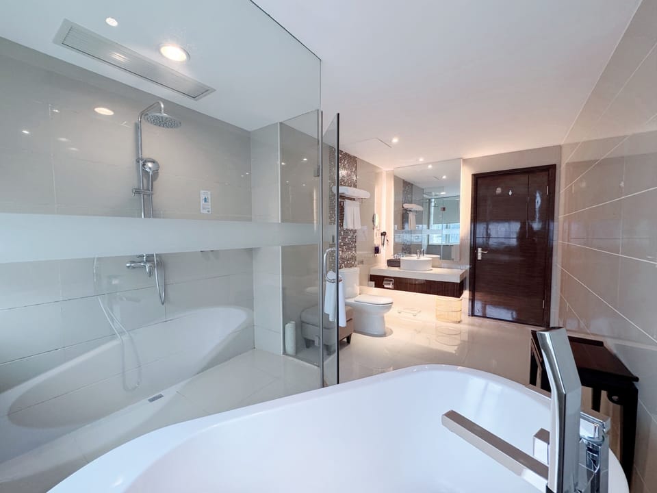 Rainfall showerhead, designer toiletries, hair dryer, slippers