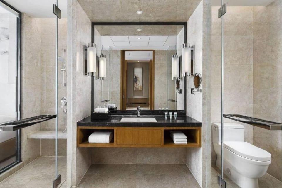 Shower, hair dryer, slippers, towels