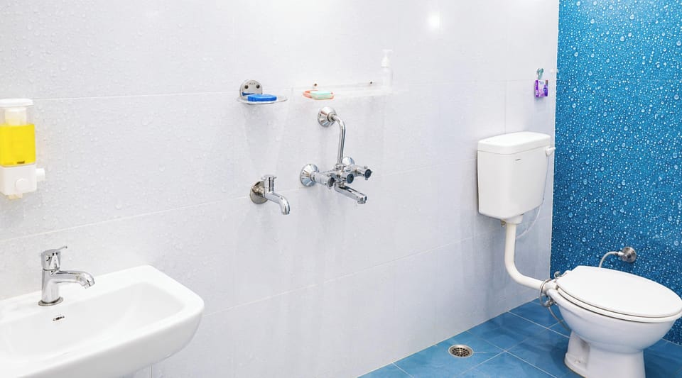 Shower, rainfall showerhead, slippers, towels