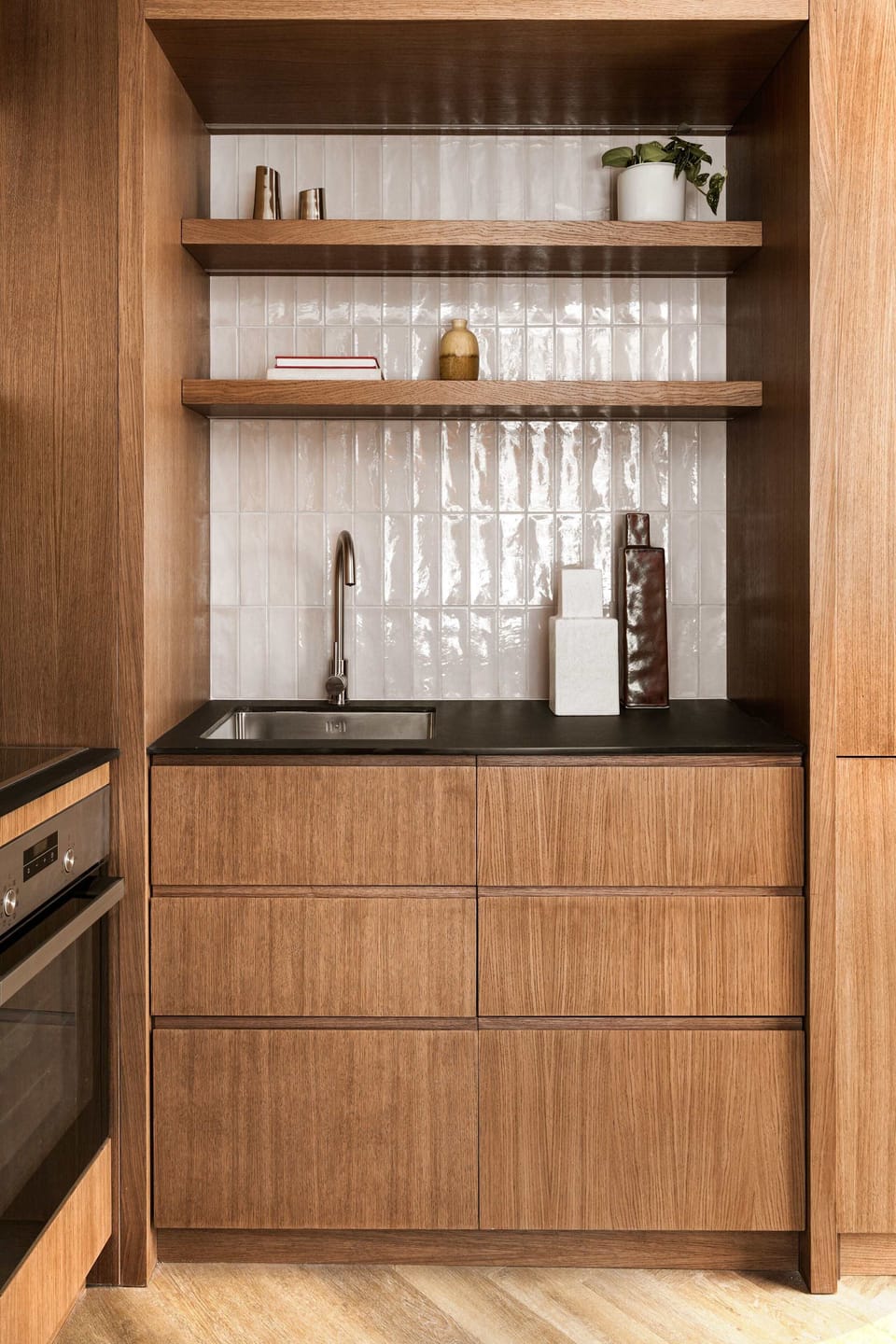 Wooden Kitchen Storage with Glassware and Amenities