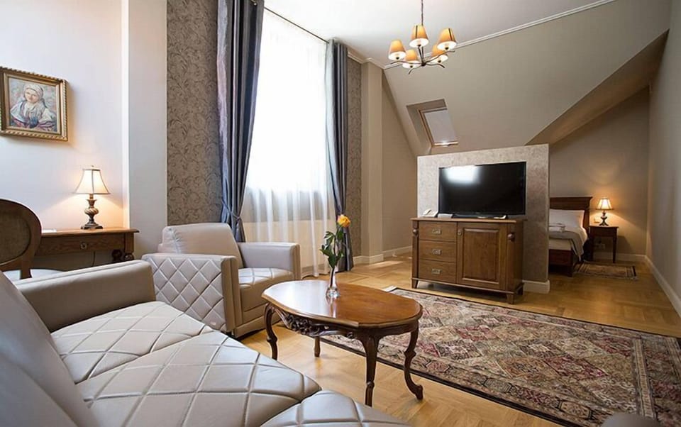 Prestige Double Room | Living room | Flat-screen TV