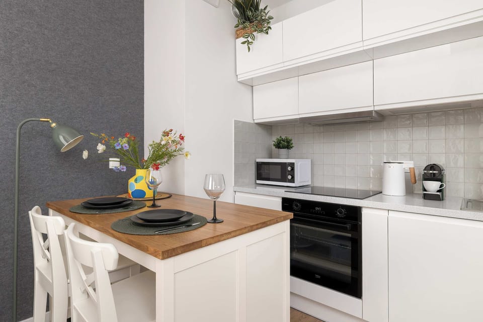 Cook and dine in style with the modern kitchenette and dining area.
