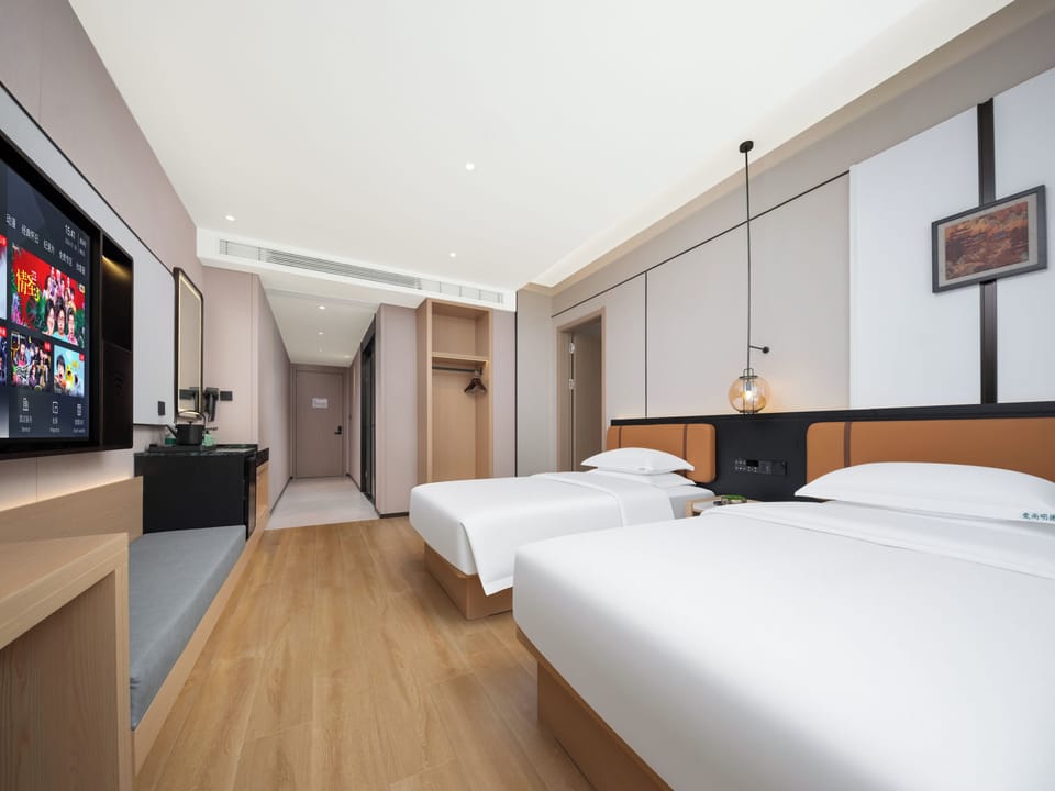 Premium bedding, down comforters, pillowtop beds, free minibar