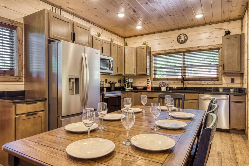 Cabin with a View in the Smoky Mountains "Honey Bear" - Dining table and fully furnished kitchen with stainless steel appliances and granite countertops