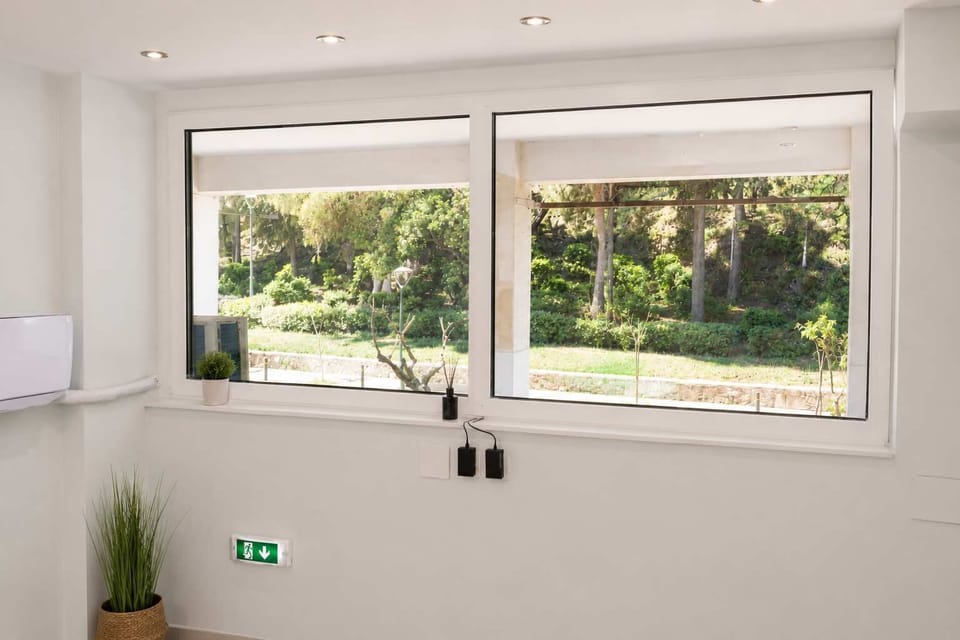 Large Window with Green Views and Bright Interior Atmosphere