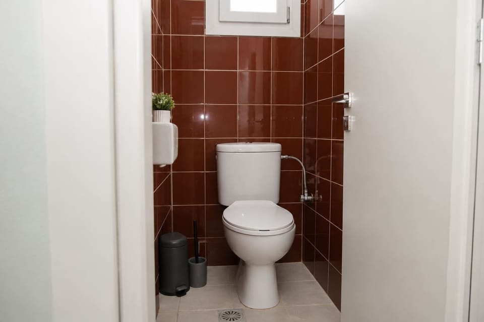 Additional WC  with Elegant Dark Tile Accents
