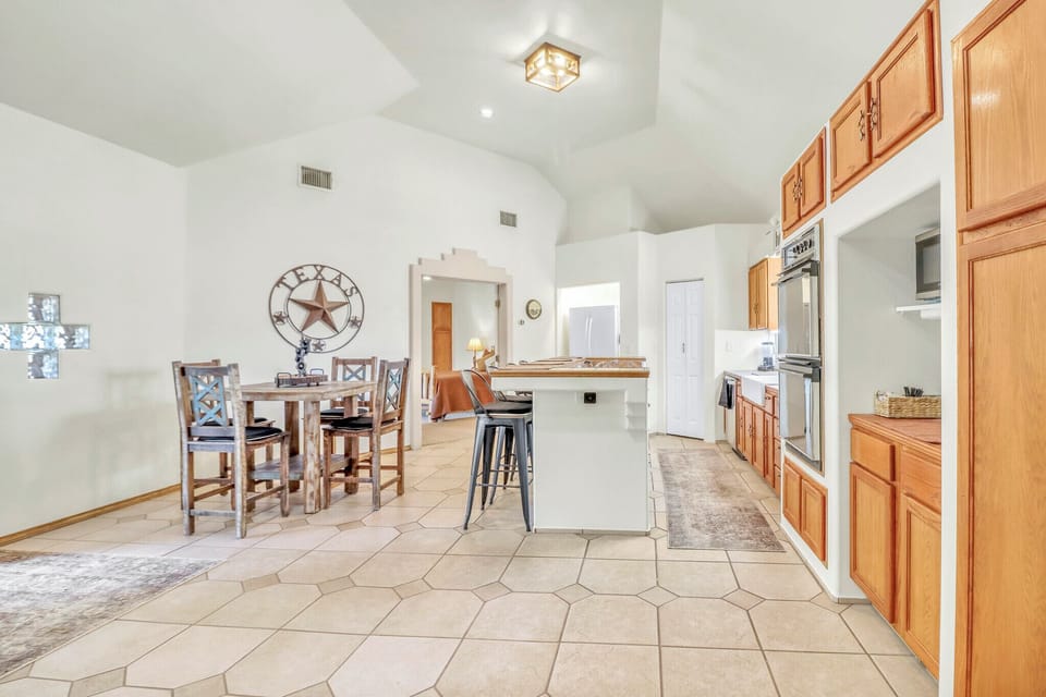 The spacious kitchen flows seamlessly into the dining area