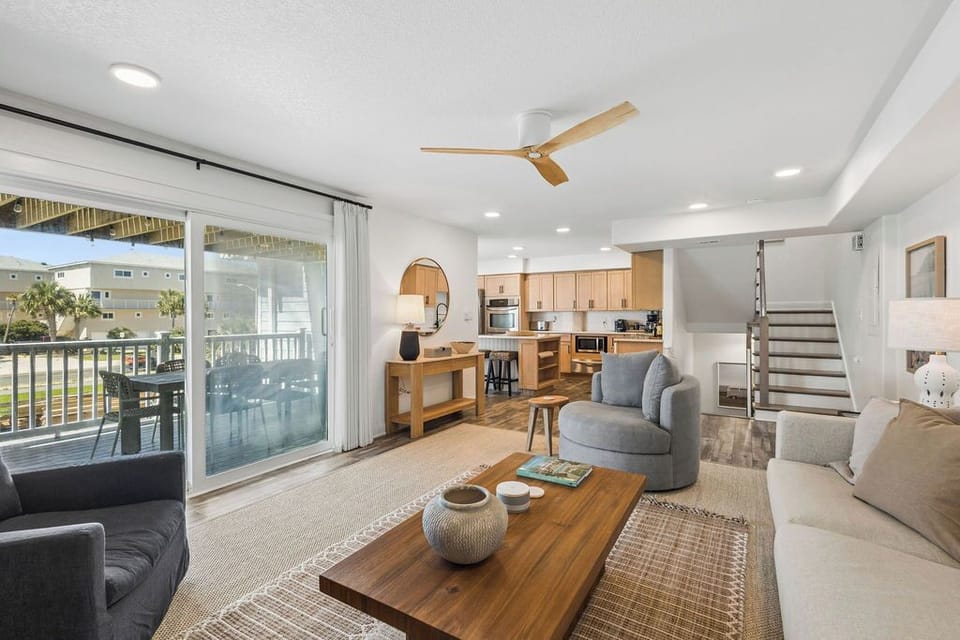 Living Room features a balcony with outdoor dining 