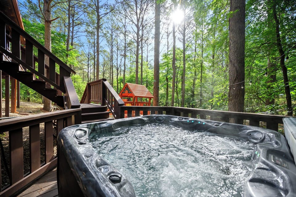 Private hot tub surrounded by peaceful forest views and fresh mountain air