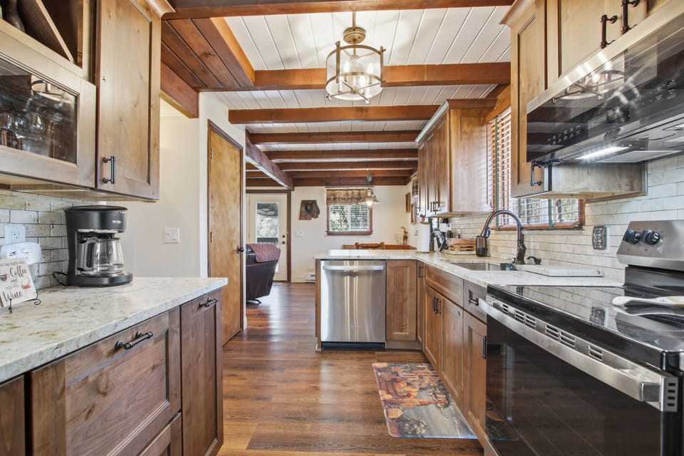 Kitchen flows open to the main living + dining area at Dogwood Retreat