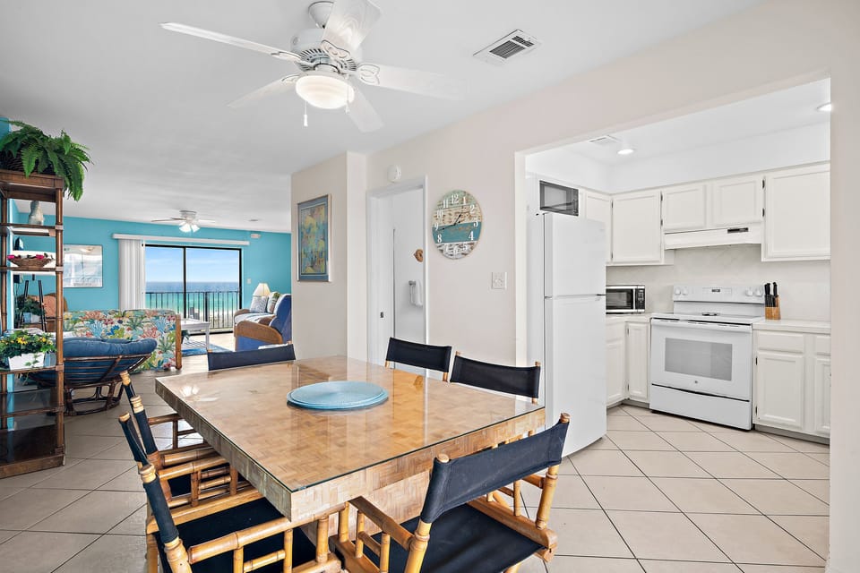 An open, breezy layout that flows from kitchen to dining to living, with the Gulf peeking through. Made for easy days together.