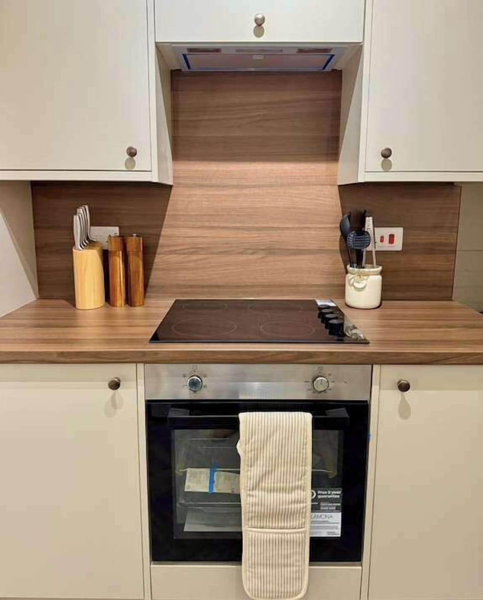 Electric hob and oven located in the kitchen