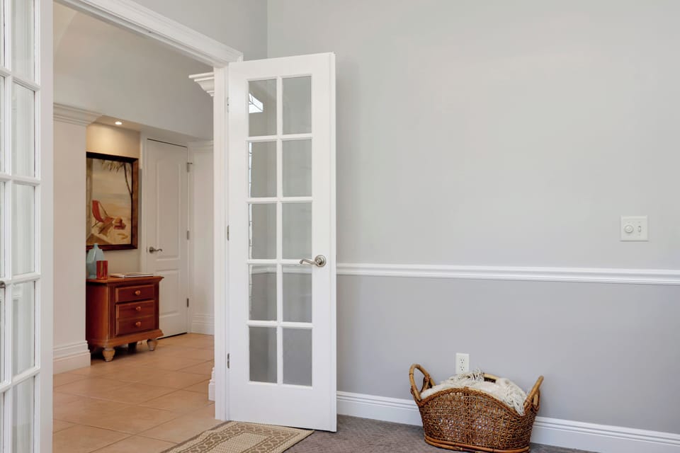 French Doors Separate Den from Foyer