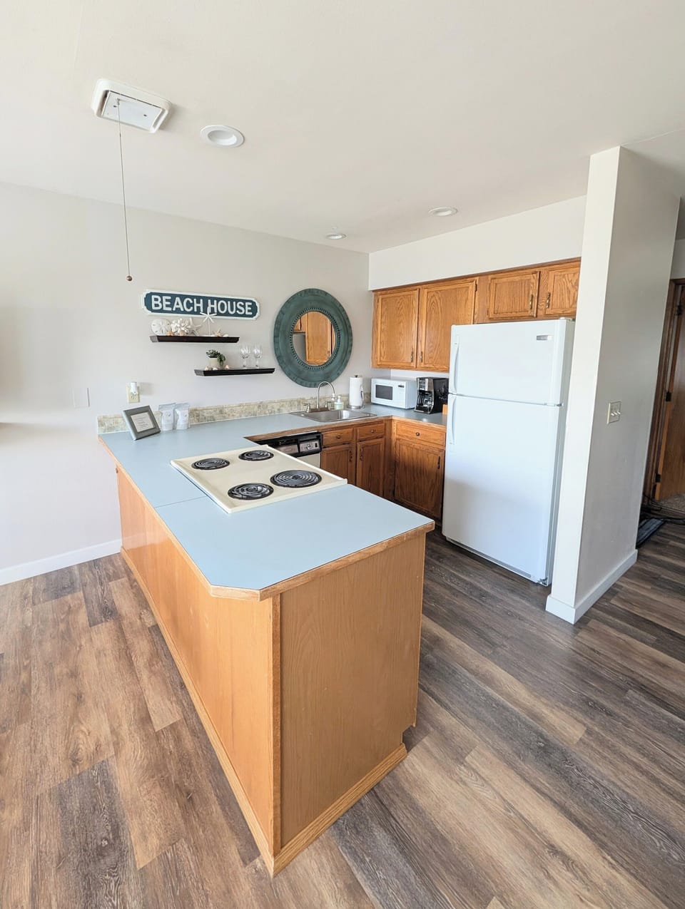 A full service kitchen stocked with essential pots, pans, plates, and more! 