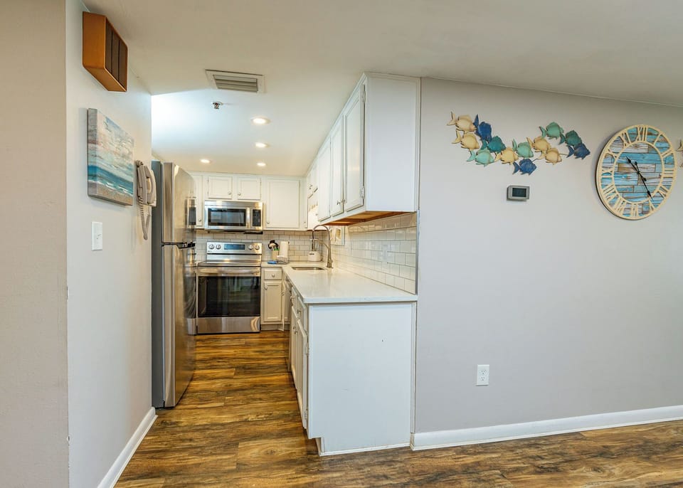 Embrace family time in the kitchen, where sleek appliances and bright decor inspire culinary adventures together