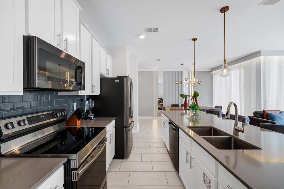 Modern fully equipped kitchen with everything needed for cooking and dining at home.