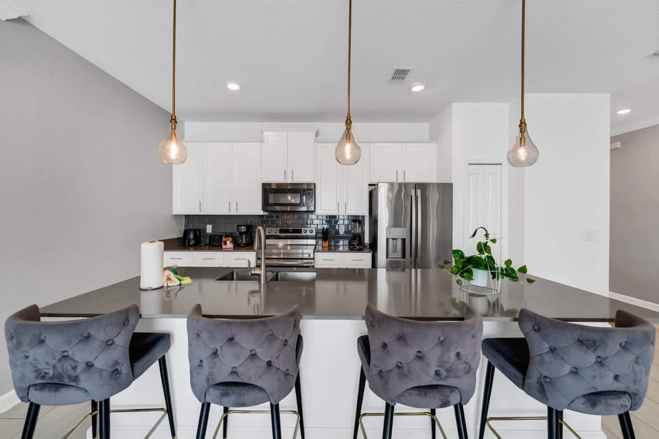 Modern fully equipped kitchen with everything needed for cooking and dining at home.