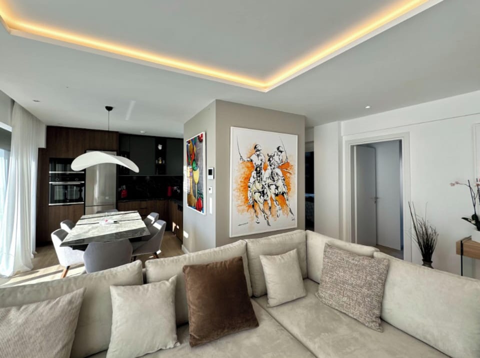 Apartment, City View | Living area | 55-inch Smart TV with satellite channels