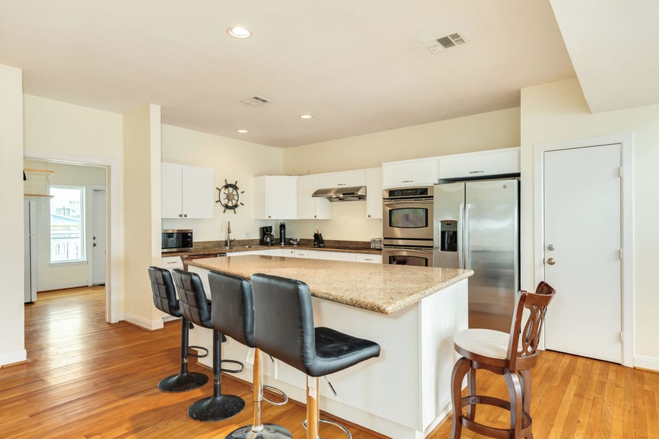 Adjacent seating for 6 at the nearby kitchen island