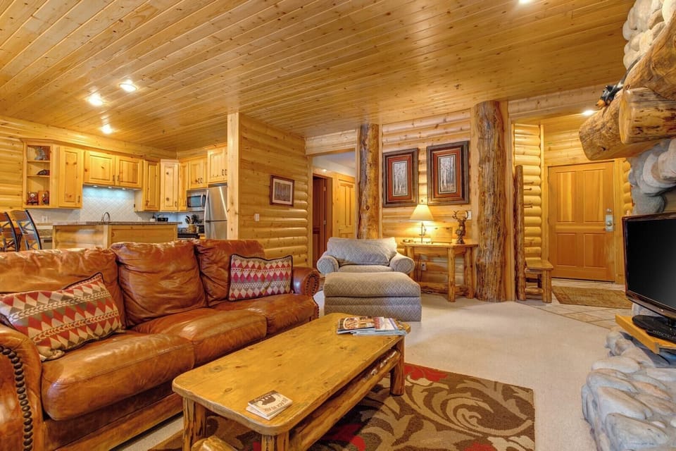 Fireside lounging with leather seating and a warm, inviting layout perfect for après-ski evenings.
