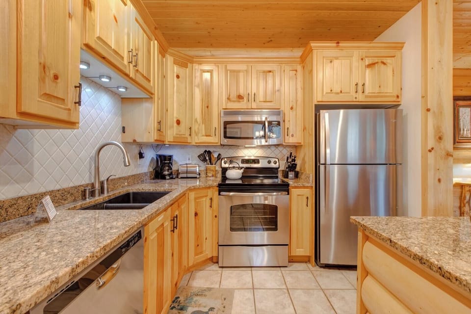 Your fully equipped kitchen includes stainless appliances, granite countertops, and everything needed for home-cooked meals.
