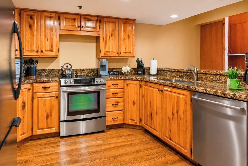 Your chef's kitchen is well-equipped with stainless steel appliances and everything you need.