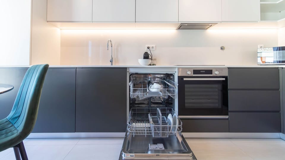 Sleek fully equipped kitchen ready for home-cooked meals #StayInPorto #PortoGetaway