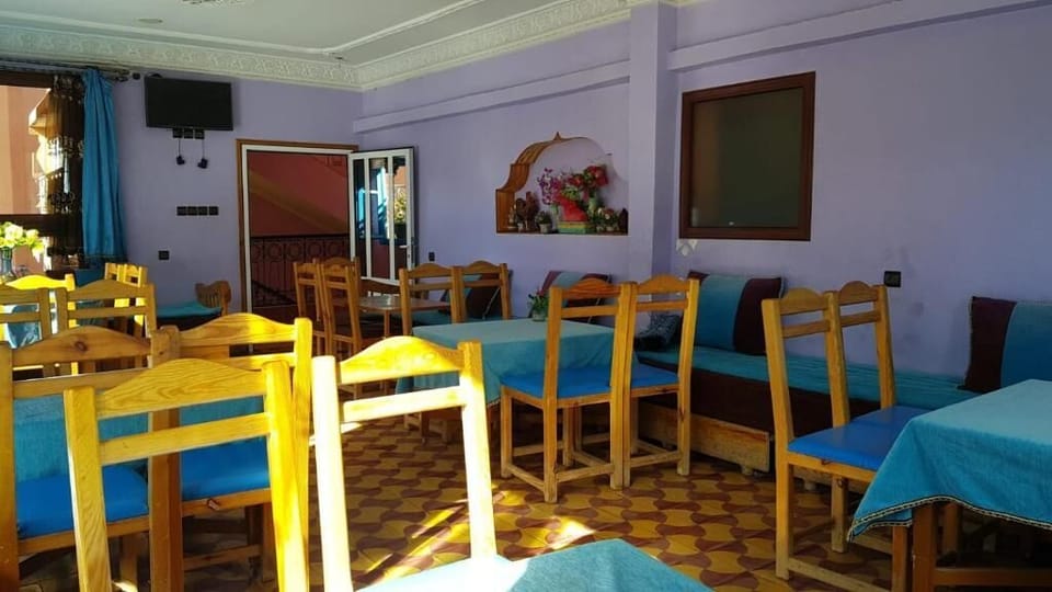 Economy Triple Room, City View | Dining