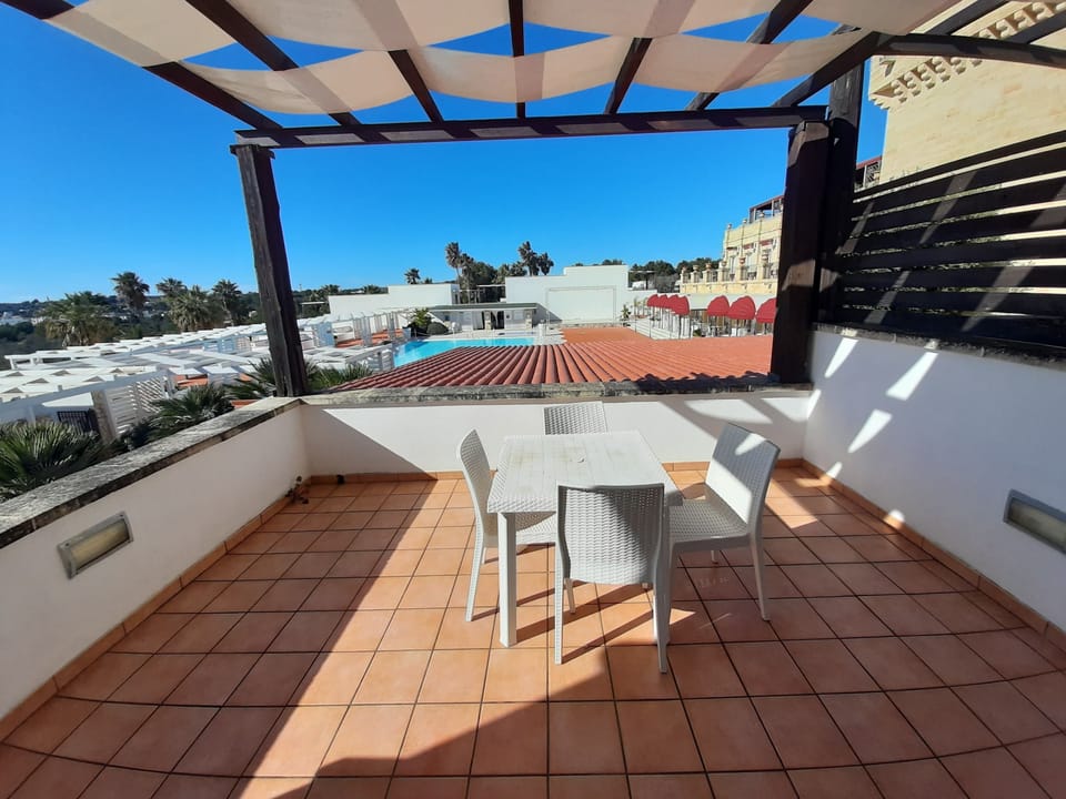Superior Apartment, Pool View | Outdoor dining