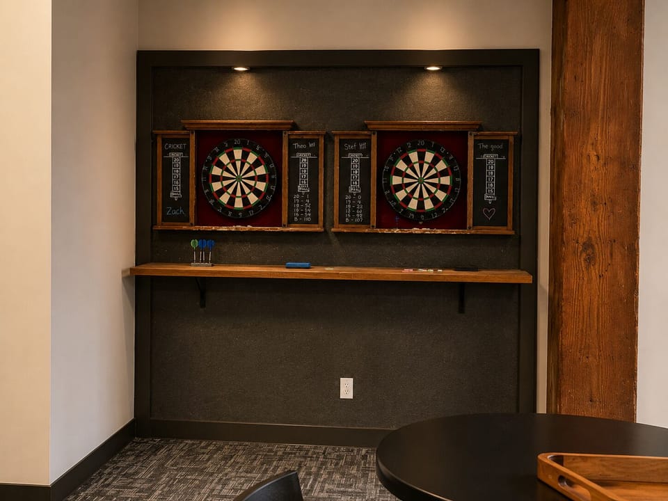 Community game room with dart boards for guest use