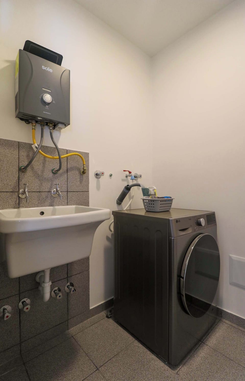 In-unit laundry area with washer and dryer for added convenience

