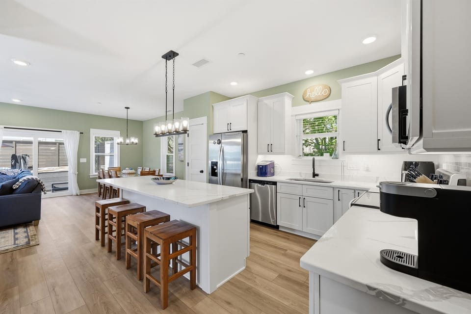 Fully stocked kitchen with oversized island and seating for the whole group