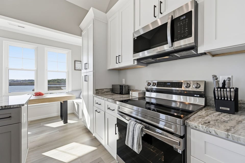 Cook, dine, and enjoy waterfront views all from the heart of the home