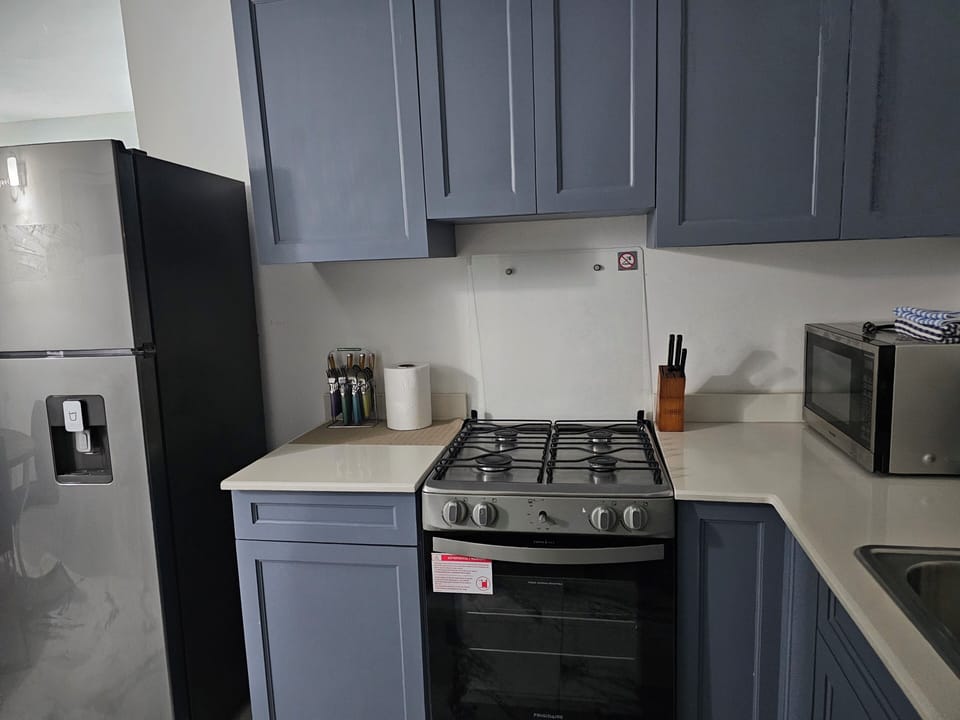 Luxury Suite, Sea View, Ground Floor | Private kitchen | Highchair