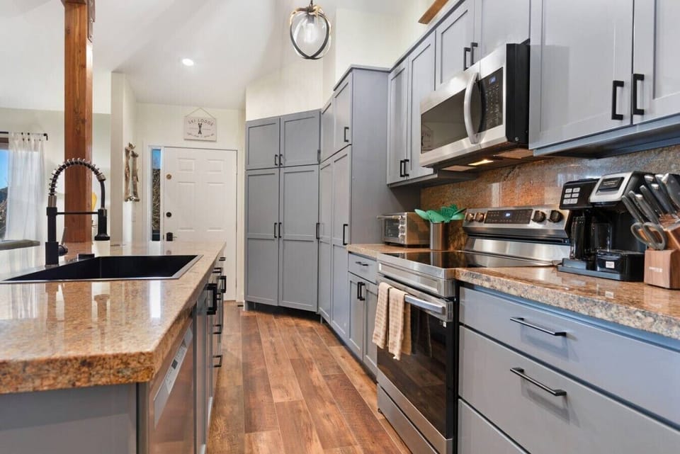 Fully equipped kitchen with large island and bar seating