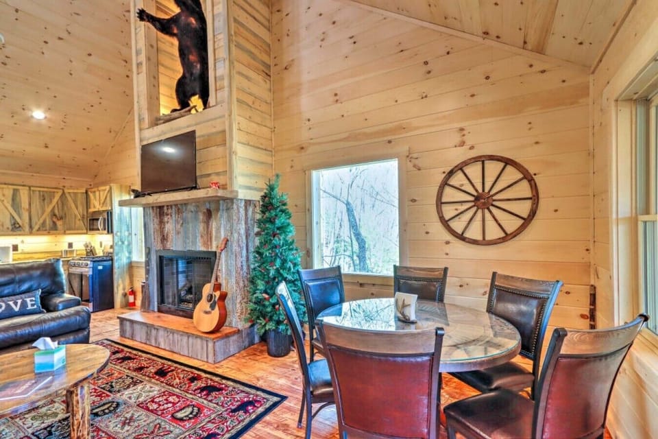 Dining Area | Round Table | Fireplace Adjacent Window Natural Light Wall Decor