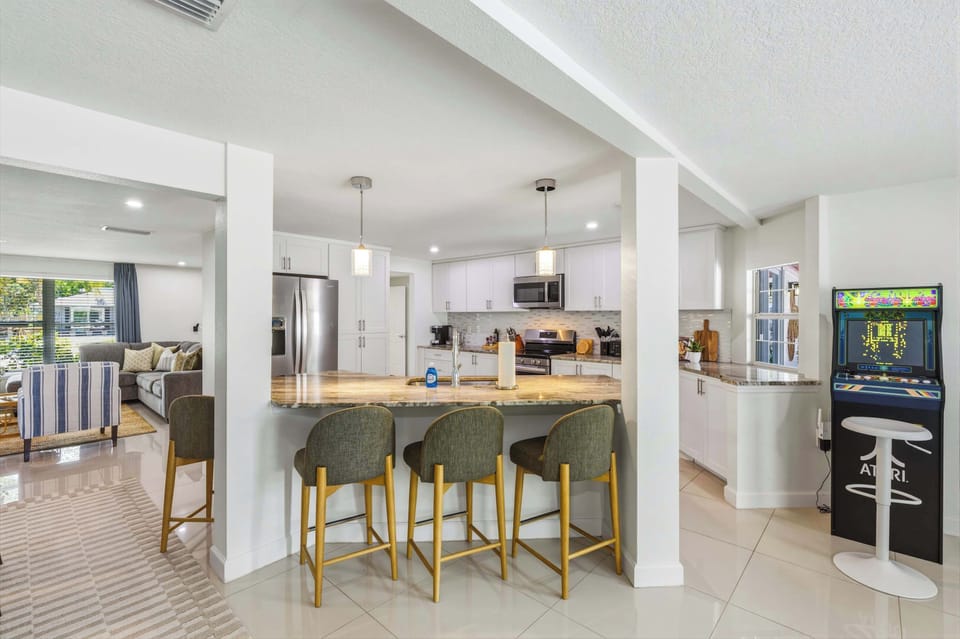 From gourmet meals to game nights — this gorgeous open kitchen has everything you need and more. 