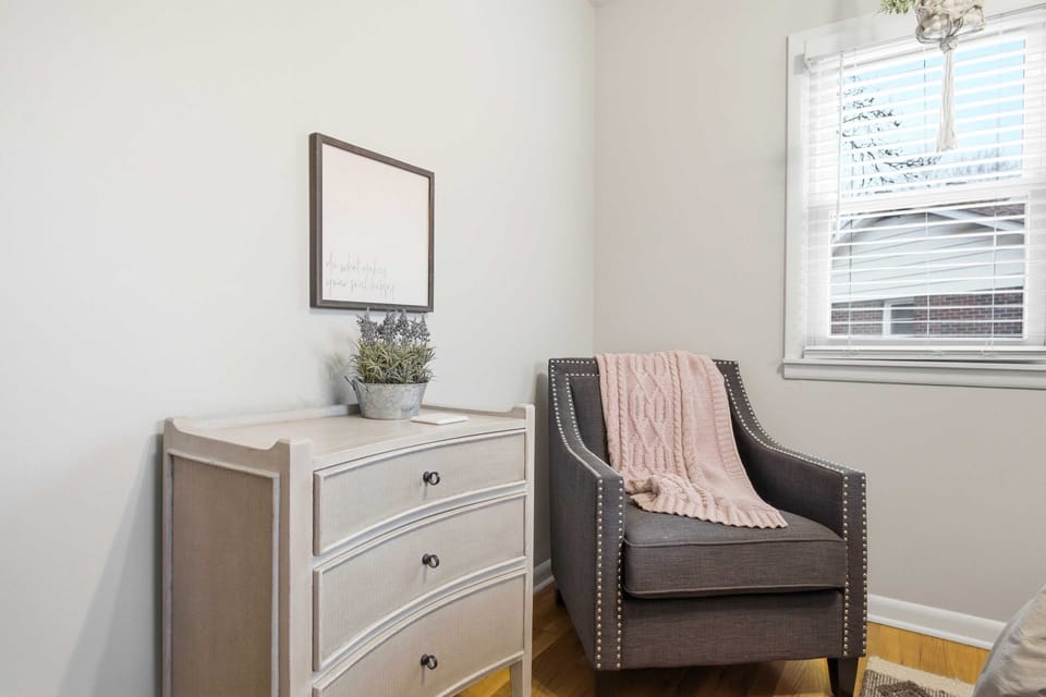 Your morning coffee’s favorite spot! This cozy nook features a chic armchair and a warm, inviting atmosphere. Curl up with a book or just enjoy the peaceful view through the window in this quiet corner of the home.