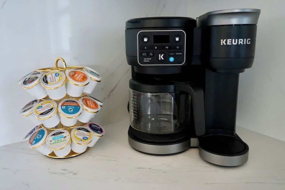 Coffee maker with both drip and k-cup options and an assortment of coffee provided for your stay