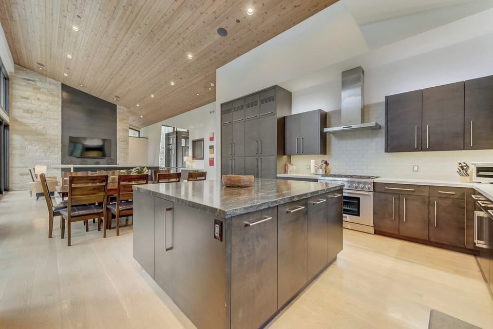 Dual fridges, stainless appliances, and prep space galore make cooking for a group effortless.
