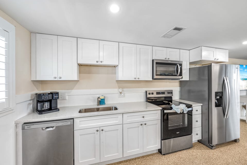 Fully equipped kitchen with modern appliances.